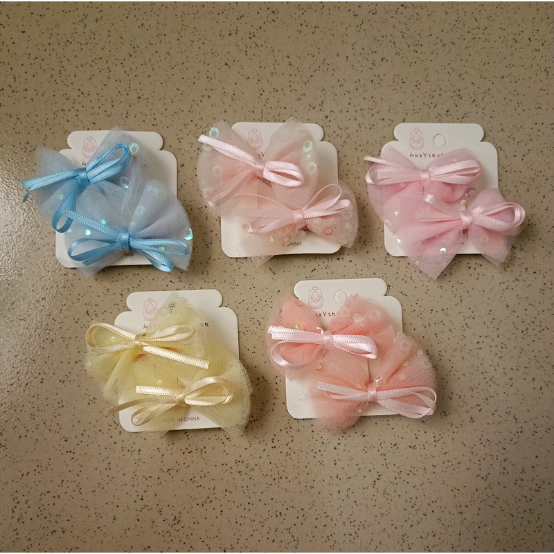 Kẹp tóc cho bé kiểu nơ hoạt hình