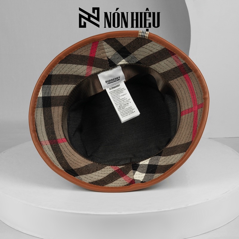 Mũ lưỡi trai - Nón Bucket phối viền da hoạ tiết Burberry MADE IN BANGLADESH Full Tem Mark hãng