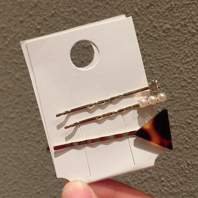 Kẹp tóc hình trái tim và ngọc trai