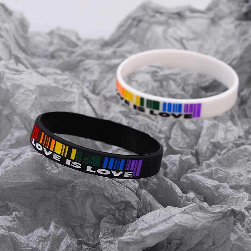 Vòng Tay Cặp Bằng Cao Su Mềm Màu Trắng Đen In Chữ LOVE IS LOVE