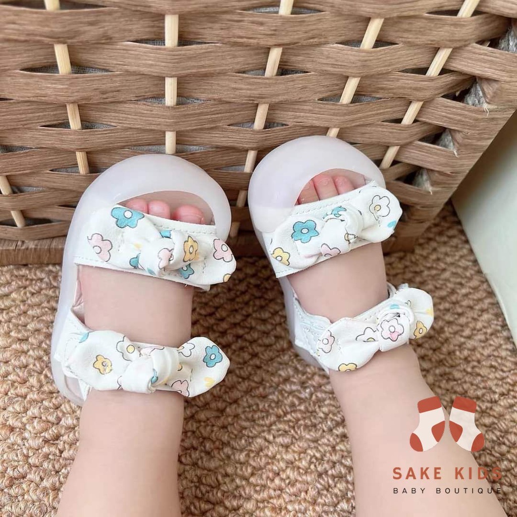 Sandal tập đi chống vấp phối nơ hình Bông hoa mũi có đế chống trơn trượt kiểu dáng Hàn Quốc mới nhất M865