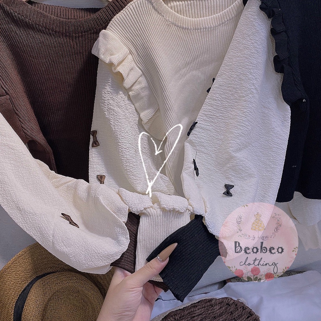 Áo len phối bèo tay phồng nude đính nơ Quảng Châu