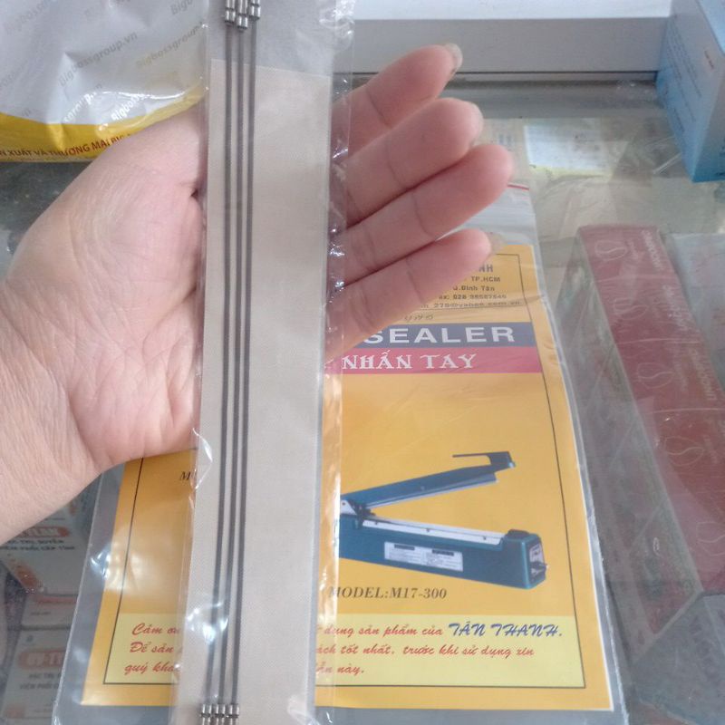Dây nhiệt+ giấy chịu nhiệt máy ép túi Tân Thanh