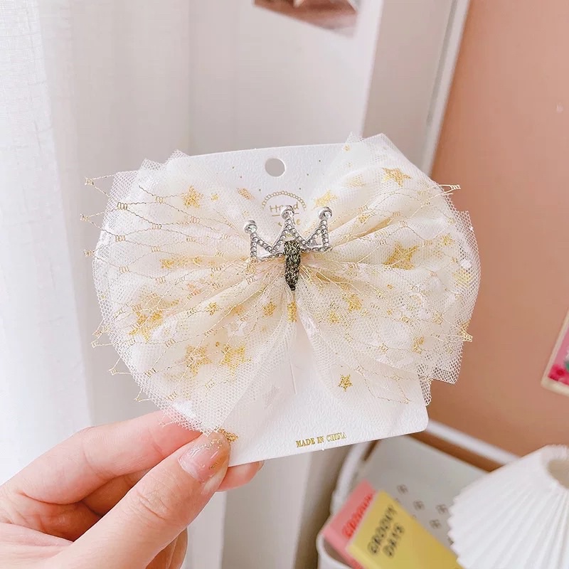 Kẹp tóc nơ tone vàng xinh xắn cho bé