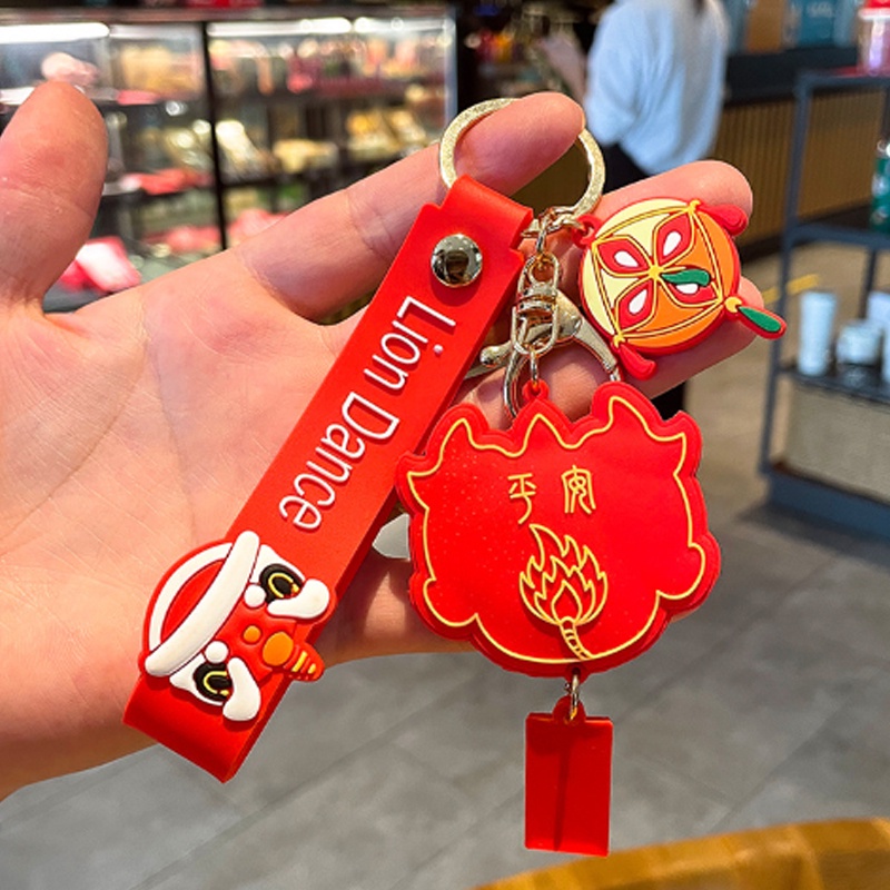 Móc khóa nhựa dẻo hình đầu Lân cá tính