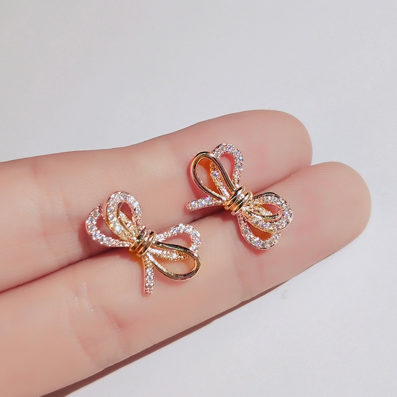 Khuyên tai JIUDUOLAN mạ bạc thiết kế nơ ruy băng đính đá nhân tạo màu vàng hồng thời trang dành cho nữ