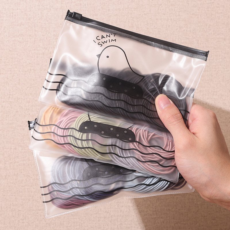 Túi zip bộ 100 thun cột cột tóc kèm túi zip