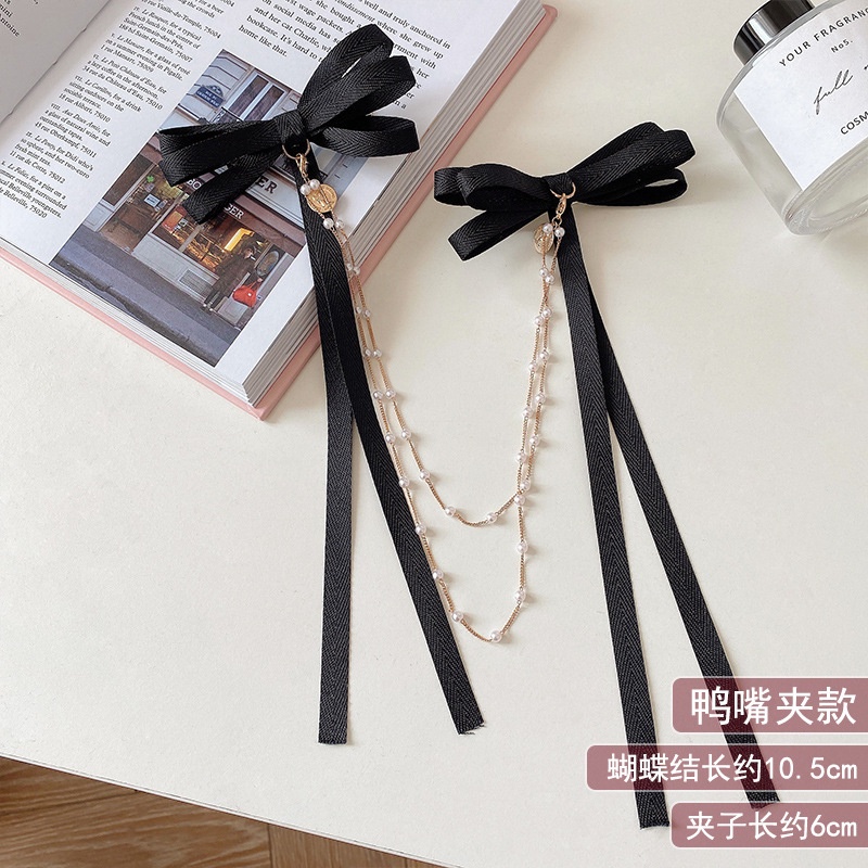 Kẹp tóc ruy băng màu đen thắt nơ phối tua rua thời trang dành cho nữ