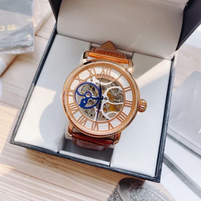 Đồng Hồ Akribos Chính Hãng Nam AK540RG XXIV Manual Wind Skeleton Dial Rose Gold-Tone Men’s Watch