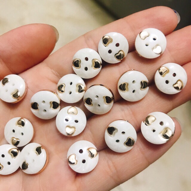 Nút tròn nhựa vàng size 14mm