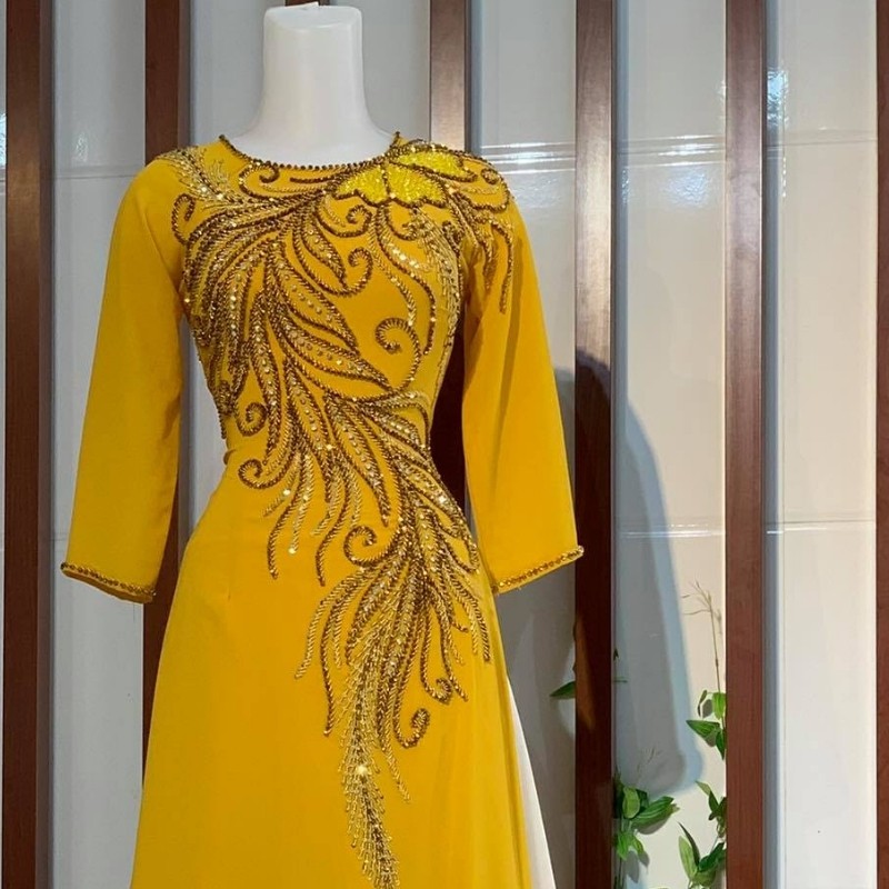 Áo dài đẹp – Áo dài cho mẹ cô dâu chú rể màu vàng trẻ trung ADM016