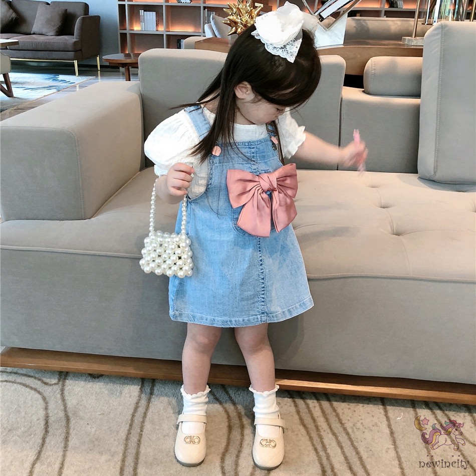 Đầm yếm denim đính nơ thắt xinh xắn thời trang dành cho bé gái
