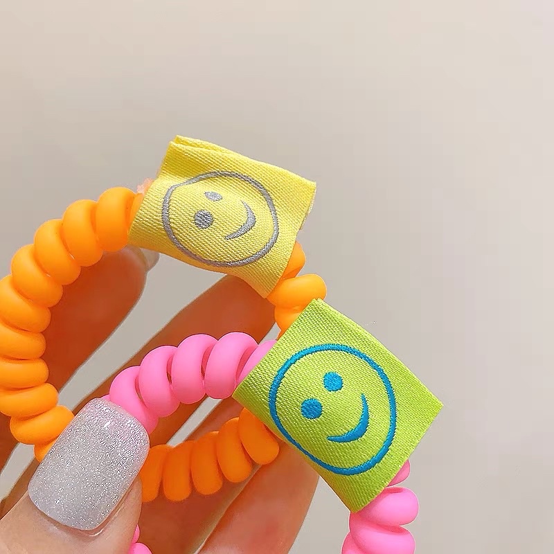 Cột tóc dây soắn maud neon hình mặt cười
