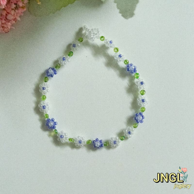 Vòng tay hạt cườm gạo kết hoa màu tím mã TK501