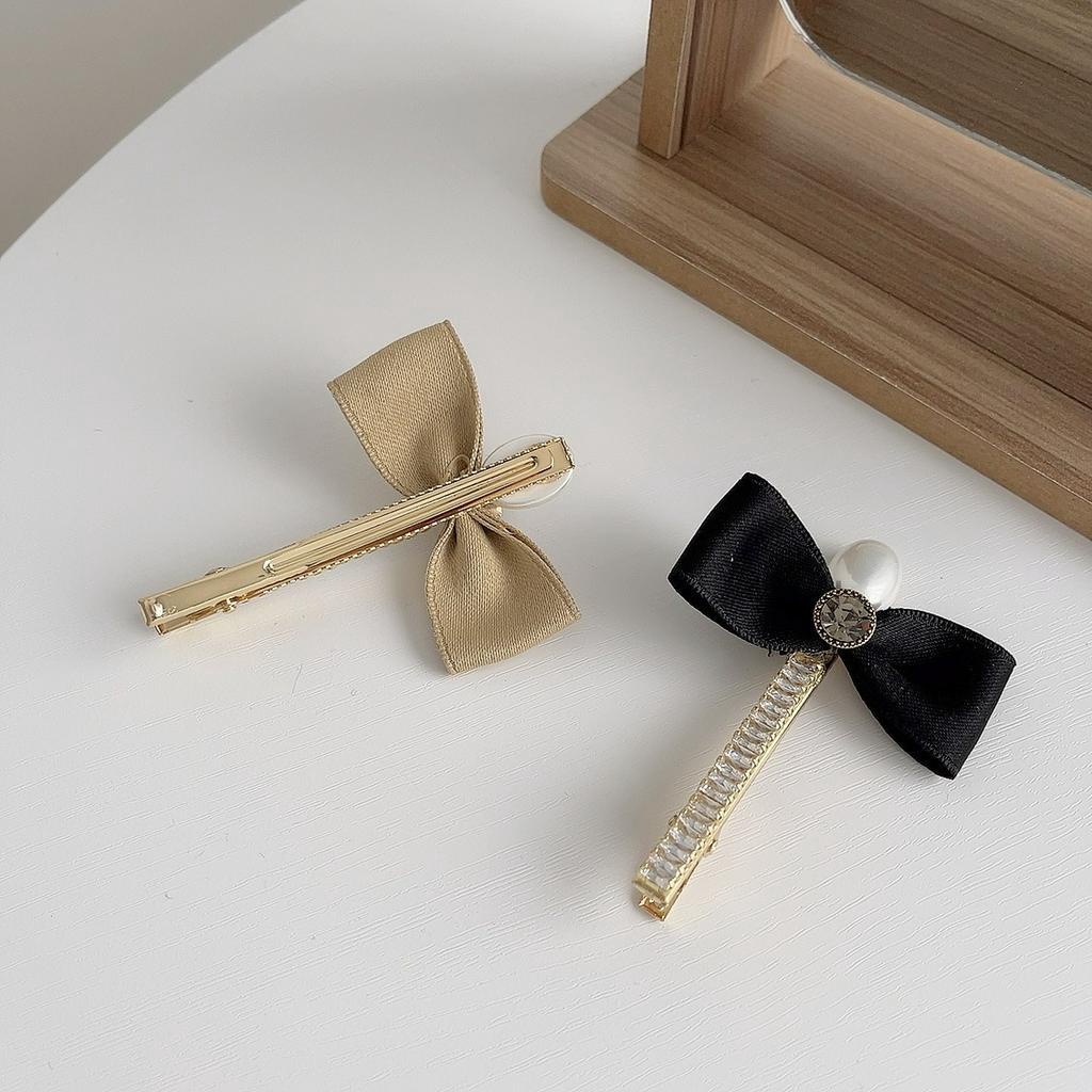 Kẹp tóc nữ hình nơ đính ngọc trai nhân tạo xinh xắn