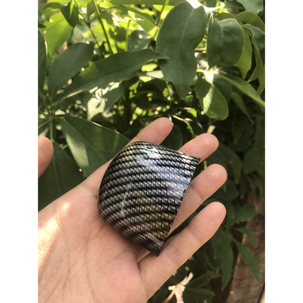 Ốp /chụp đèn soi biển số xe Exciter 150 màu Cacbon.