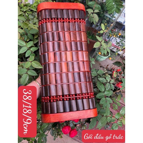 gối gỗ trắc đỏ đen .