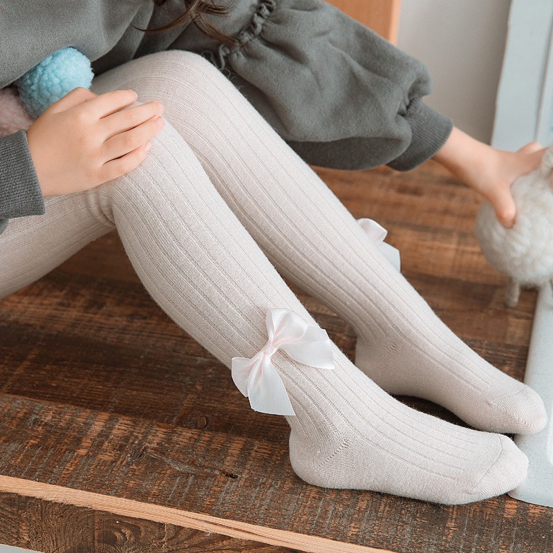 Quần tất cho bé, quần tất len mùa đông đính nơ màu trơn co giãn 4 chiều cho bé gái Xuân Cường Kids size từ 3m đến 6 tuổi