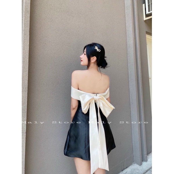 Đầm xoè nơ lưng trễ vai đen hồng xanh trắng