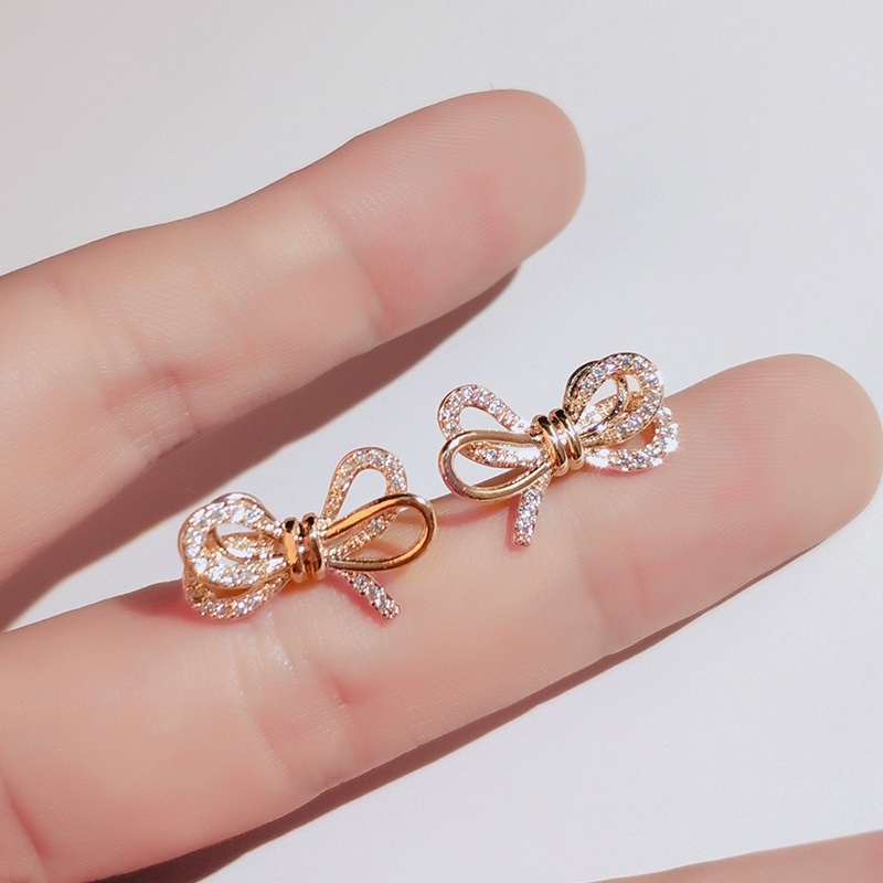 Khuyên tai JIUDUOLAN mạ bạc thiết kế nơ ruy băng đính đá nhân tạo màu vàng hồng thời trang dành cho nữ