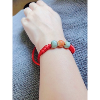 Vòng tay chỉ đỏ hạt gốm