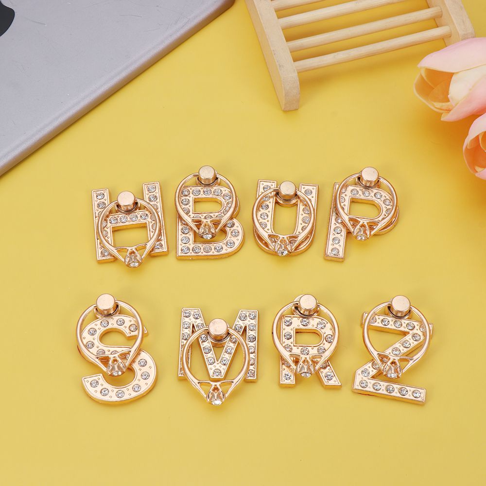 Giá đỡ điện thoại siêu mỏng dạng vòng tròn xỏ ngón xoay 360 độ hình chữ cái đính đá đa năng