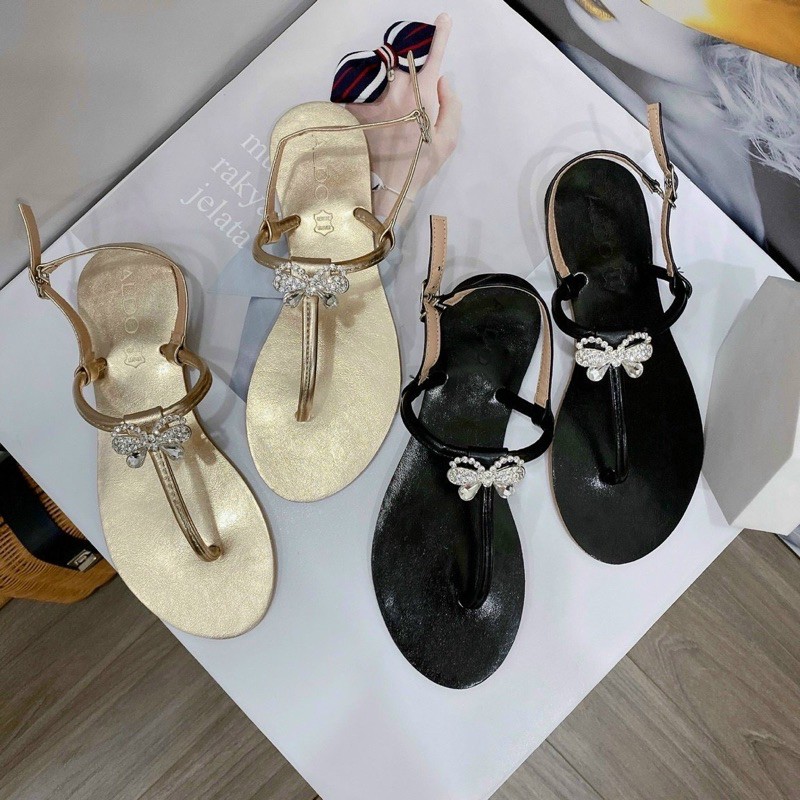 Giày nữ sandal đế bệt, họa tiết nơ đính đá, quai mảnh, chất da xi nhũ hàng Quảng Châu cao cấp KT12003