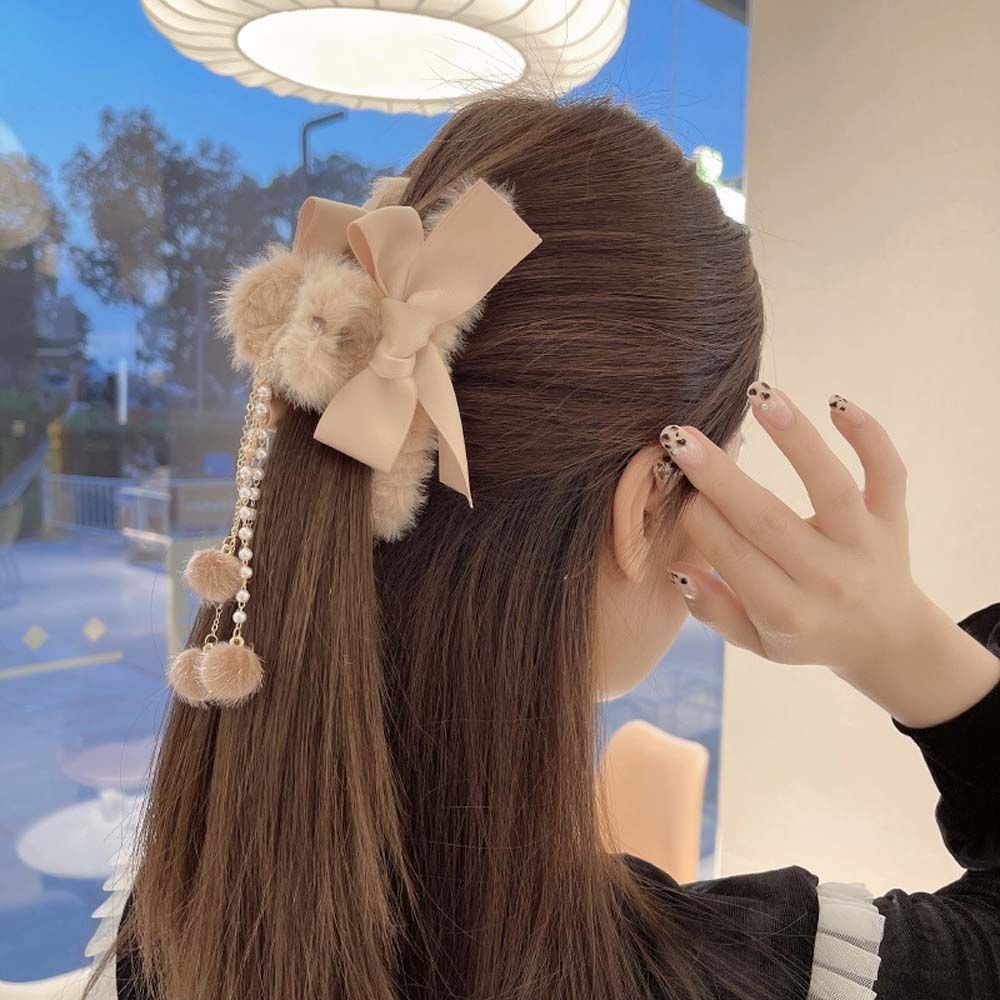 Kẹp gấp tóc nhung nơ tua rua