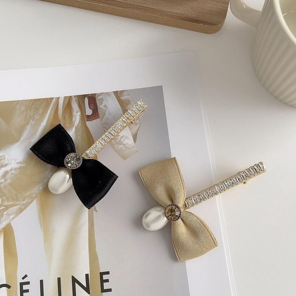 Kẹp tóc nữ hình nơ đính ngọc trai nhân tạo xinh xắn