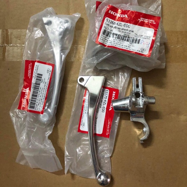 Giá đỡ tay thắng + tay thắng phải Vision zin hãng Honda