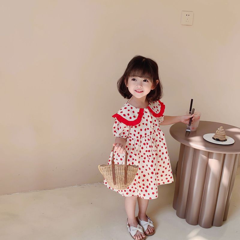 Váy trẻ em gái 2021 Quần áo trẻ em mùa hè mới phiên bản Hàn Quốc Váy chấm sóng với ve áo lớn màu đỏ Váy bình dị