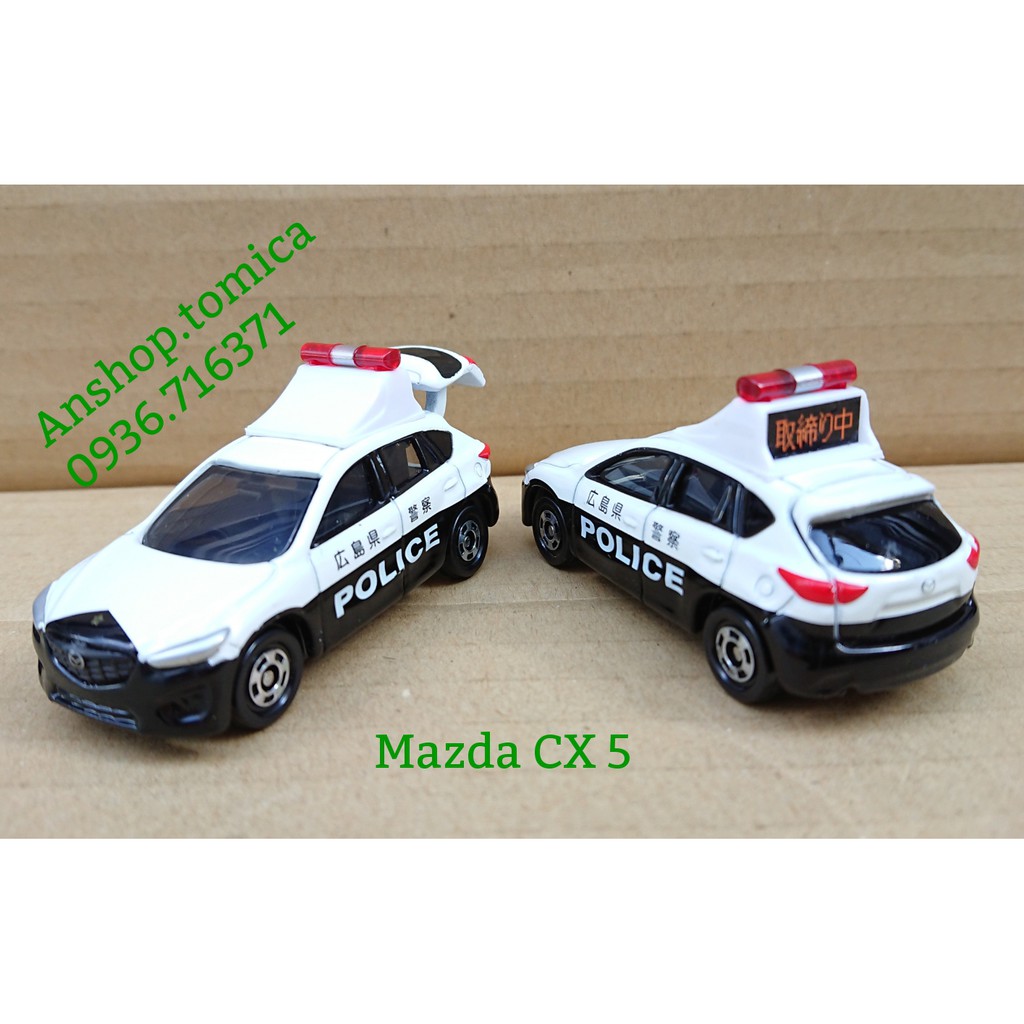 Mô hình xe C. Sát Mazda mở được cốp sau tomica Nhật Bản