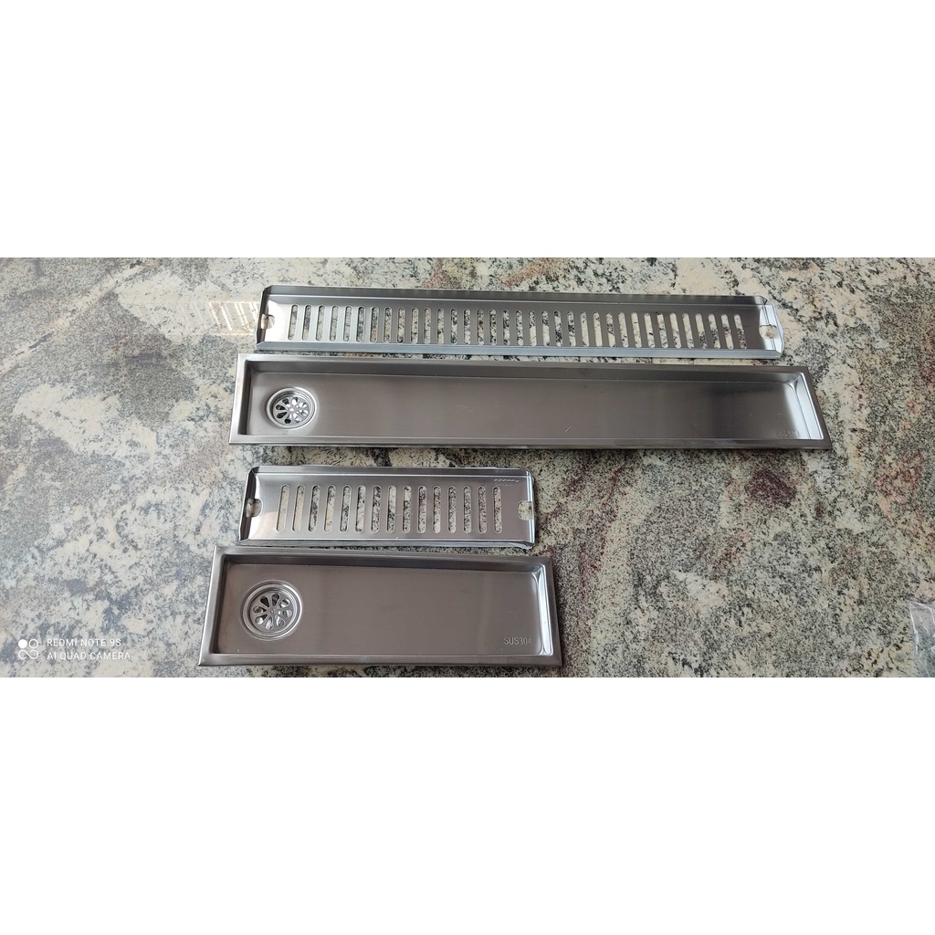 Ga thoát sàn ngăn mùi 60cm và 30 cm lỗ lệch ,lỗ cân, Inox 304, kt: dài 60cmx10cm và 30cm x10 cm,vừaống phi 48 đến phi 90