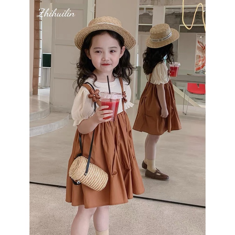 Váy yếm cam 2 bông hoa bé gái