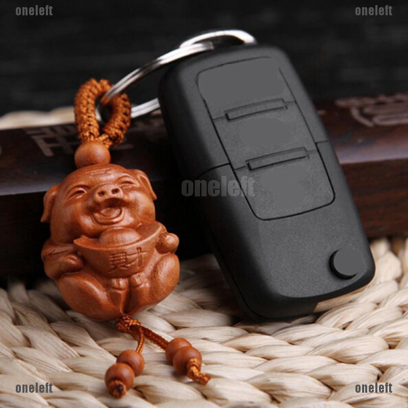 Móc khóa hình con heo bằng gỗ độc đáo cho năm Hợi