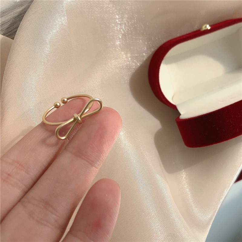 Nhẫn hở đeo ngón tay cái điều chỉnh được hình chiếc nơ đơn giản kiểu Hàn cá tính dành cho bạn nữ