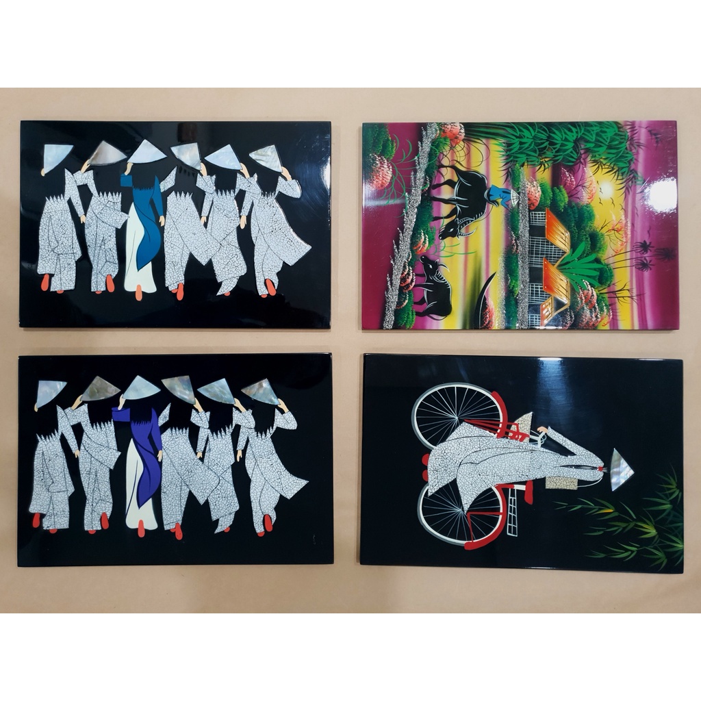 Tranh sơn mài vỏ trứng cô gái áo dài đạp xe