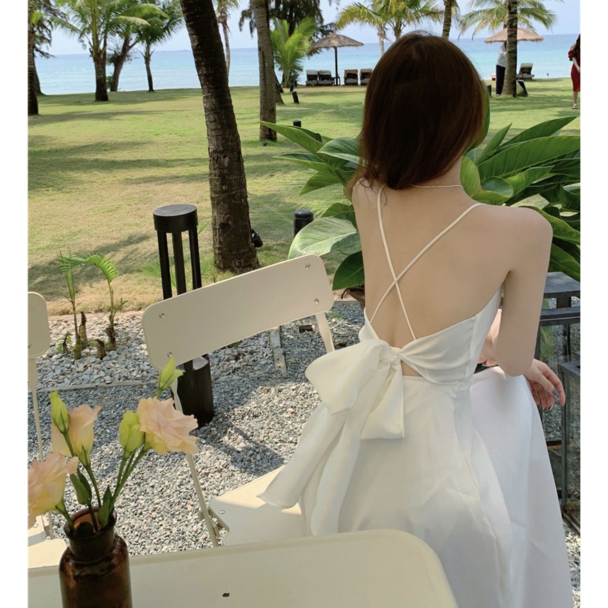 Váy maxi trắng 2 dây dáng dài đi biển hở lưng đan dây buộc nơ chất vải lụa satin dày dặn phong cách tiểu thư