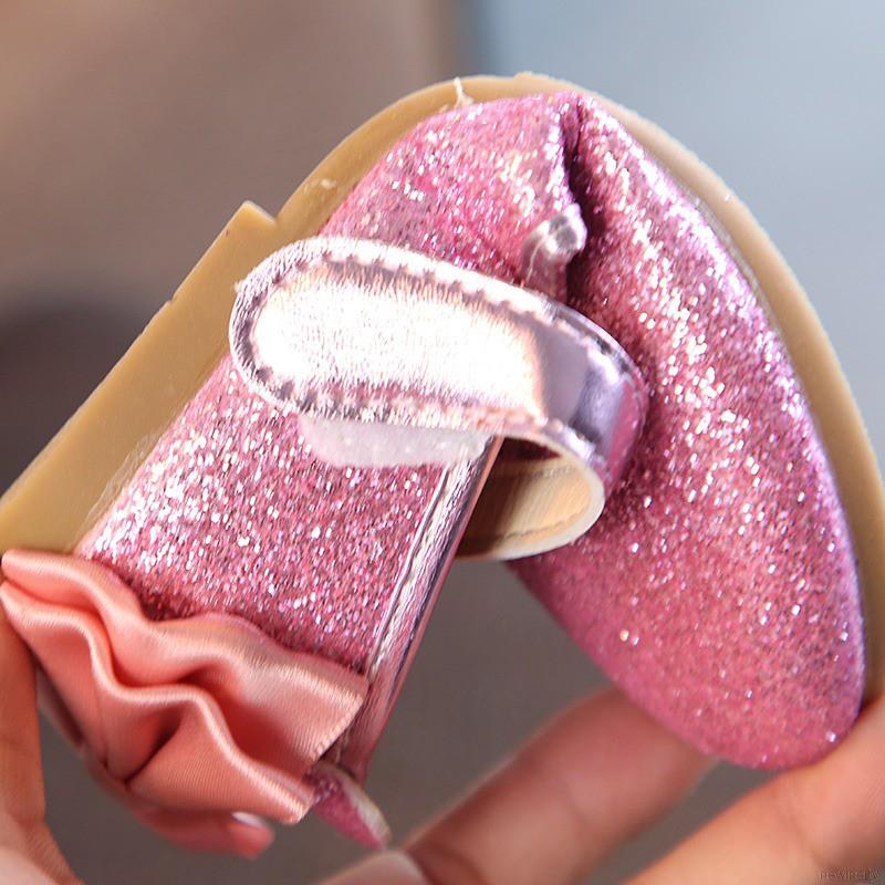 Đôi giày da PU đính nơ kim tuyến cho bé