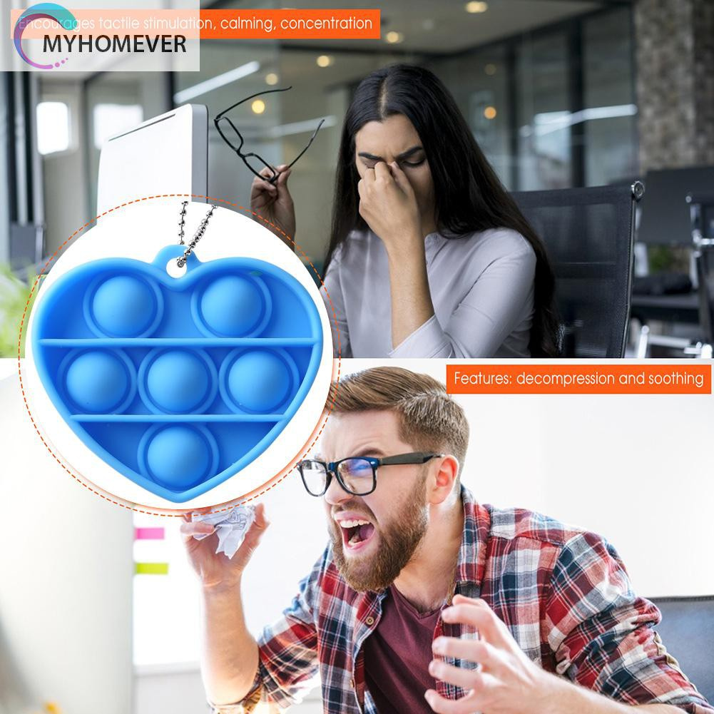 Móc khóa silicon hình trái tim có thể bóp tay đàn hồi bề mặt bật bong bóng