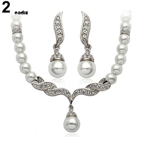 Bộ dây chuyền + bông tai hình đôi cánh đính ngọc trai giả