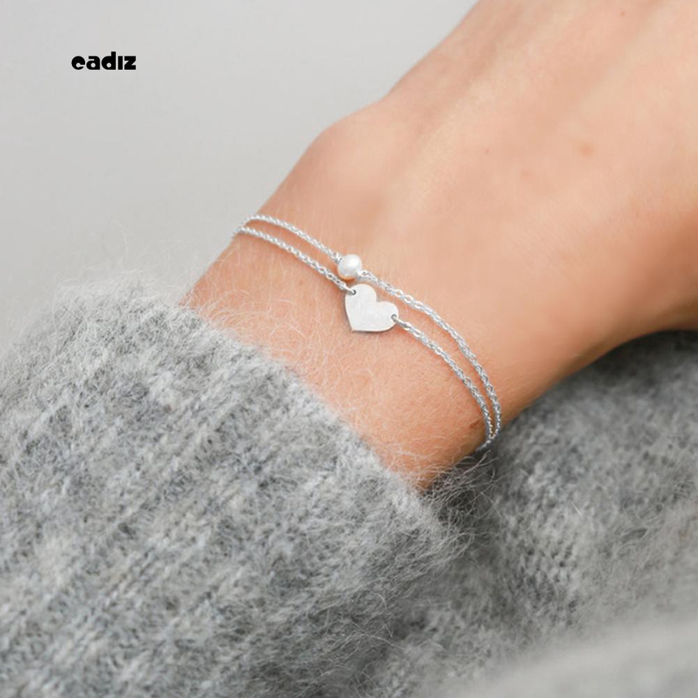 Vòng tay đính hạt giả ngọc trai trái tim