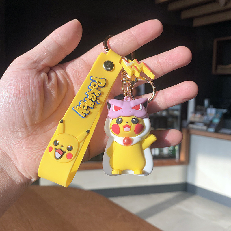 the creative personality of pikachu schobag around plastic plastic plastic dolls in the car with the keys of his necklace.