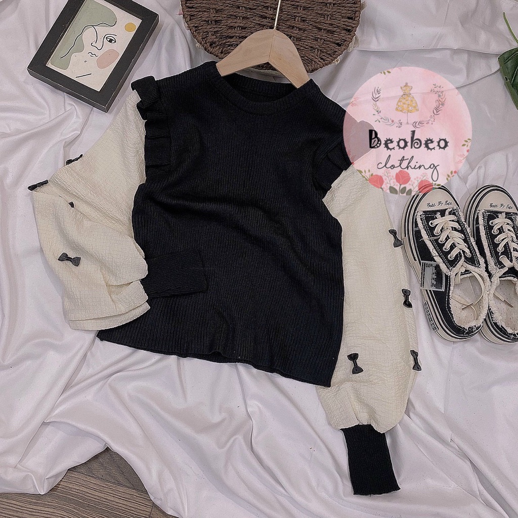 Áo len phối bèo tay phồng nude đính nơ Quảng Châu