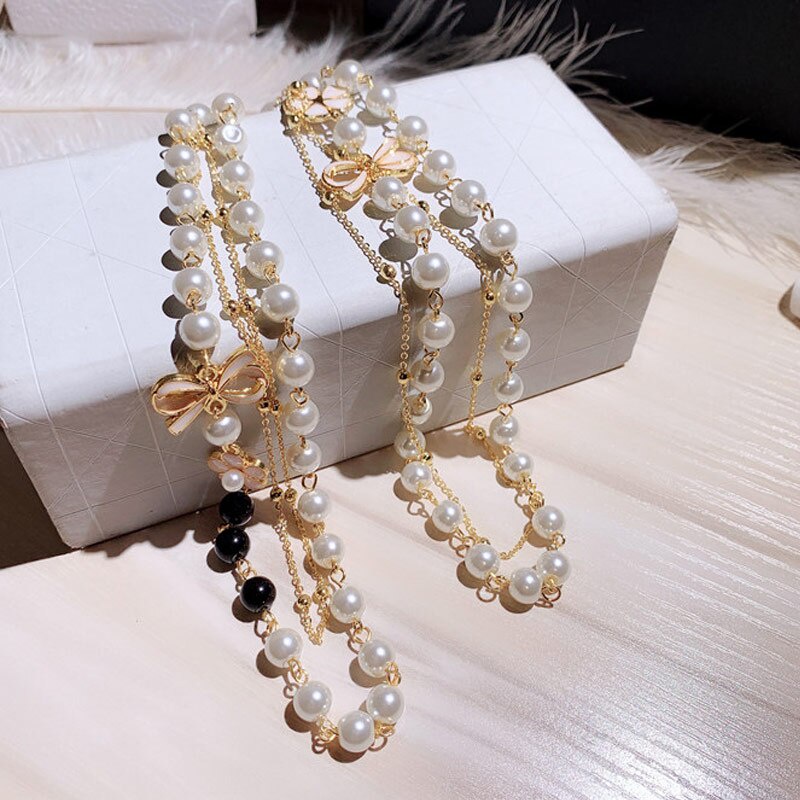 Vòng cổ Dài Nhiều Lớp Đính Hạt Ngọc Trai Và Nơ Xinh Xắn