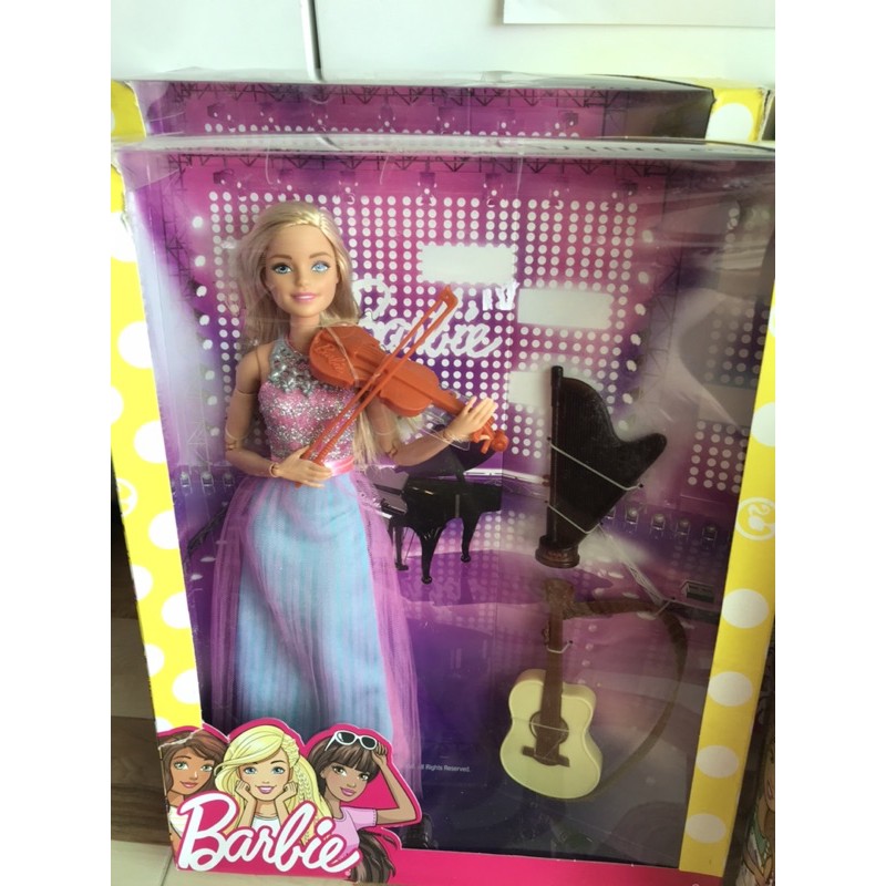 Búp bê Barbie chơi nhạc cụ dân chính hãng.