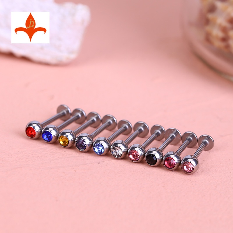 Khuyên titan thanh chân dẹt bi tròn đính đá