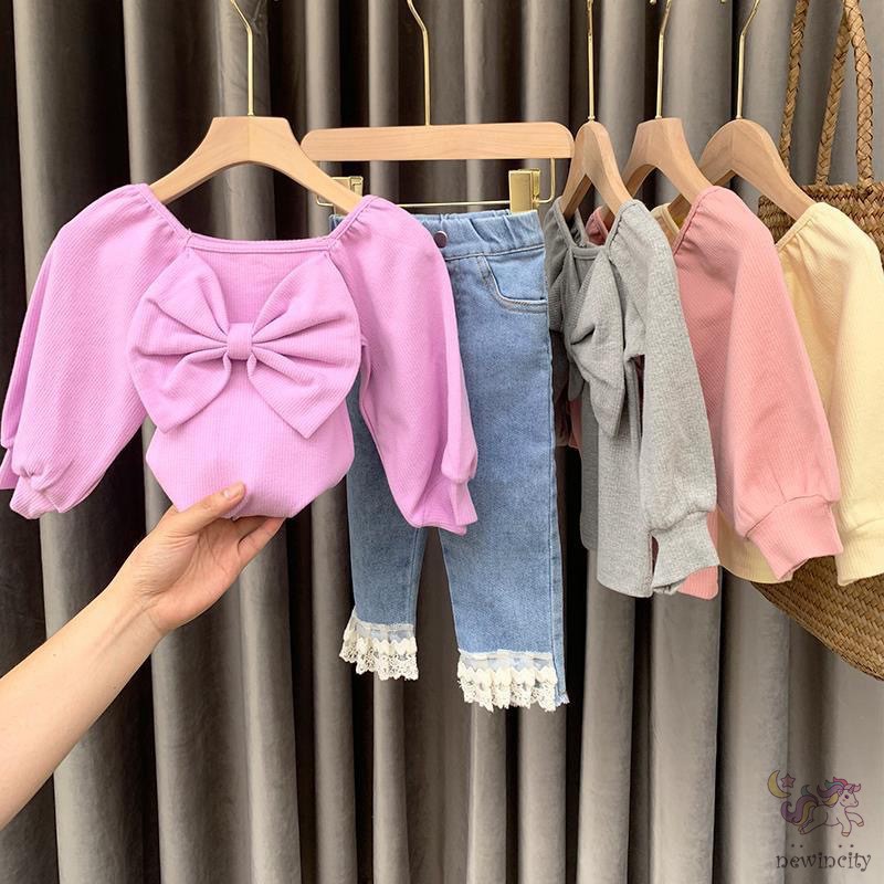 Áo dài tay phối nơ phong cách đáng yêu dành cho bé gái