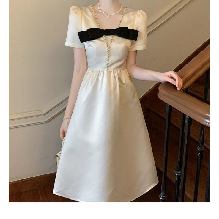 ĐẦM KEM CỔ V ĐÍNH ĐÁ NƠ NGỰC ĐEN