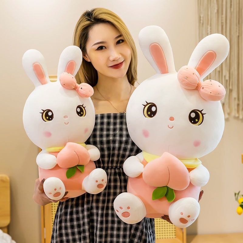 Gấu bông thỏ hồng, thỏ tai dài nhồi bông ôm trái đào vải miniso cao cấp - Unishop